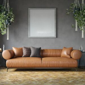 Salon moderne chaleureux avec canapé cuir marron et déco épurée chez les-rives-des-renards dans le Tarn